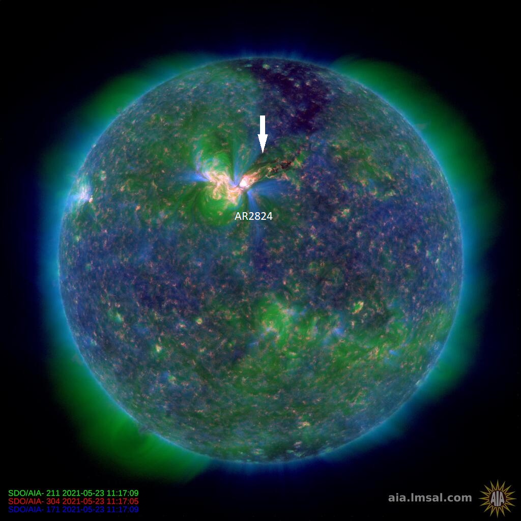 SDO-AIA image of the solar disc showing region AR2824 and the lift off of a CME on the 23rd of May (see white arrow).